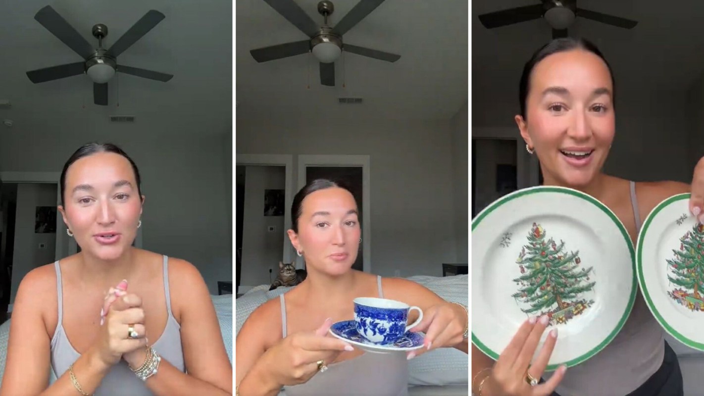 A woman showcases vintage dishware, including a blue cup and two Christmas-themed plates.