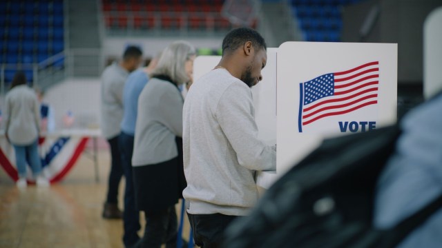 Voters casting their ballots at a polling station.