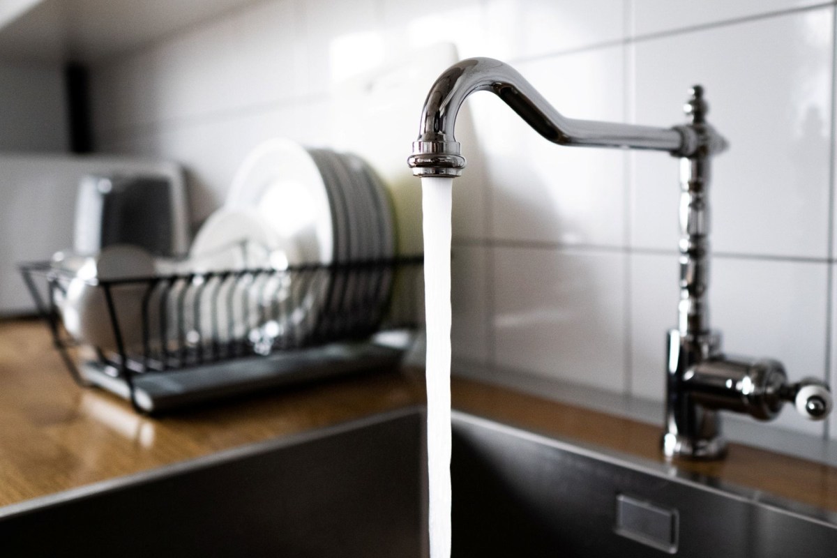 Water running out of a faucet.