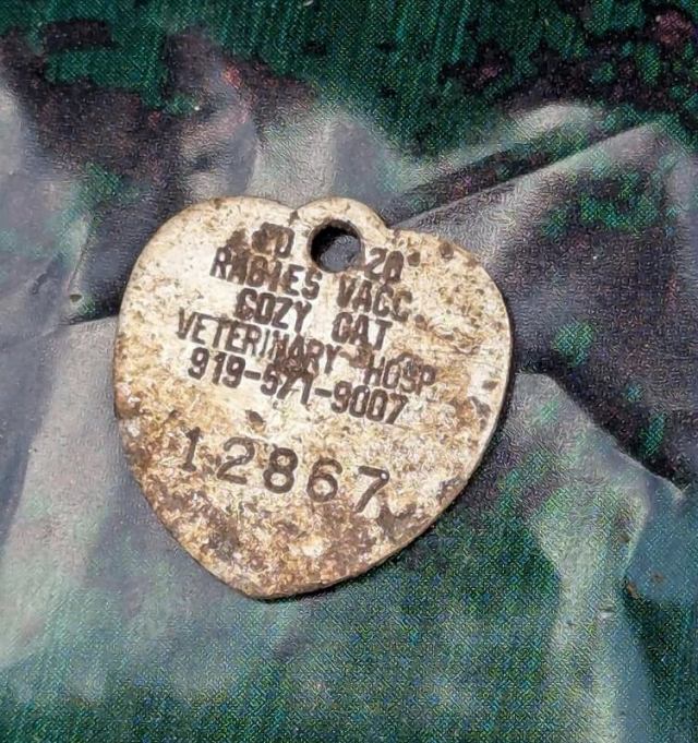 A Miracle-Gro fertilizer bag with a partially visible product label and dirt.