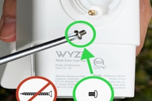 A hand holding a tool near a Wyze Solar Cam with symbols indicating correct installation guidance.
