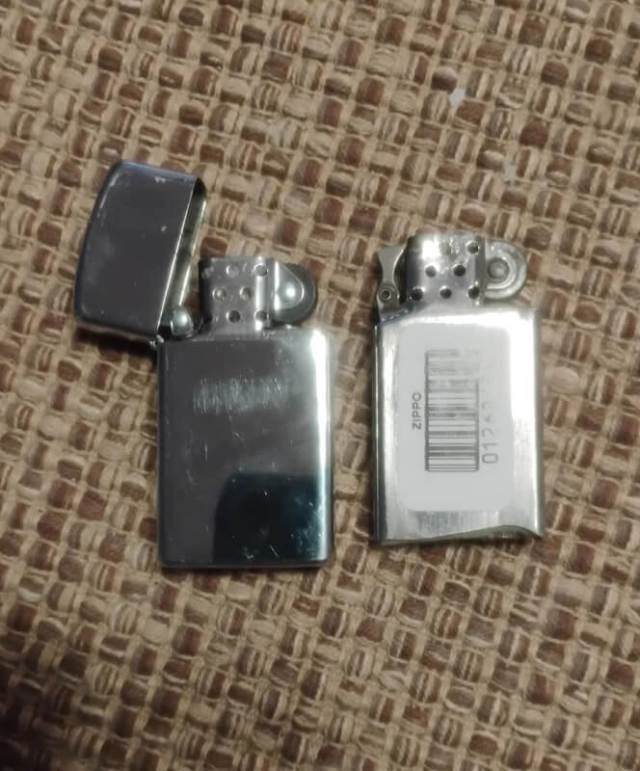 An old and a new Zippo lighter.