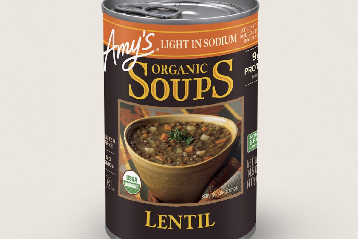 A can of Amy's Organic Lentil Soup featuring a bowl of soup on the label, highlighting its gluten-free and organic qualities.