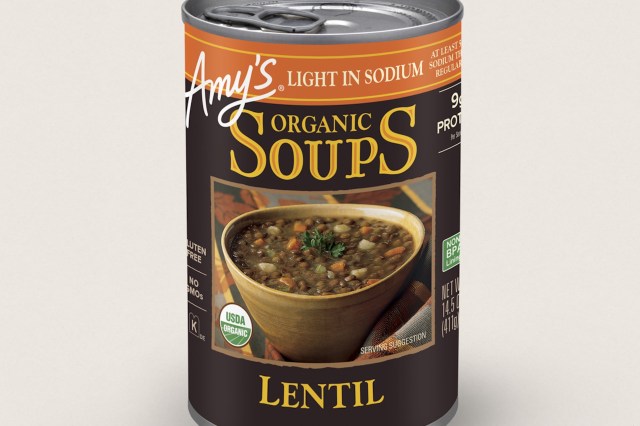 A can of Amy's Organic Lentil Soup featuring a bowl of soup on the label, highlighting its gluten-free and organic qualities.