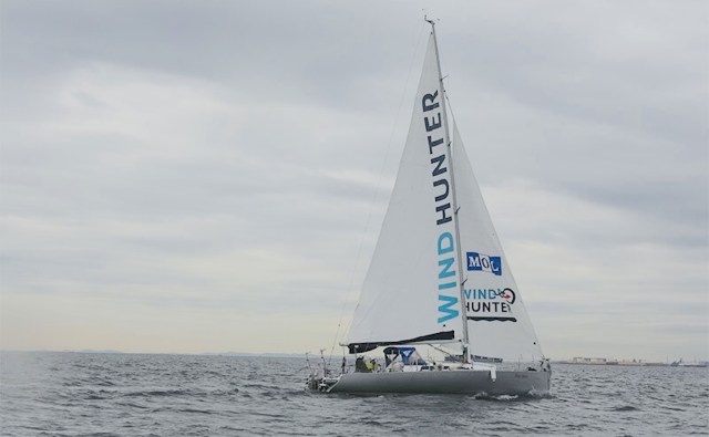The "Wind Hunter" sailboat on water.