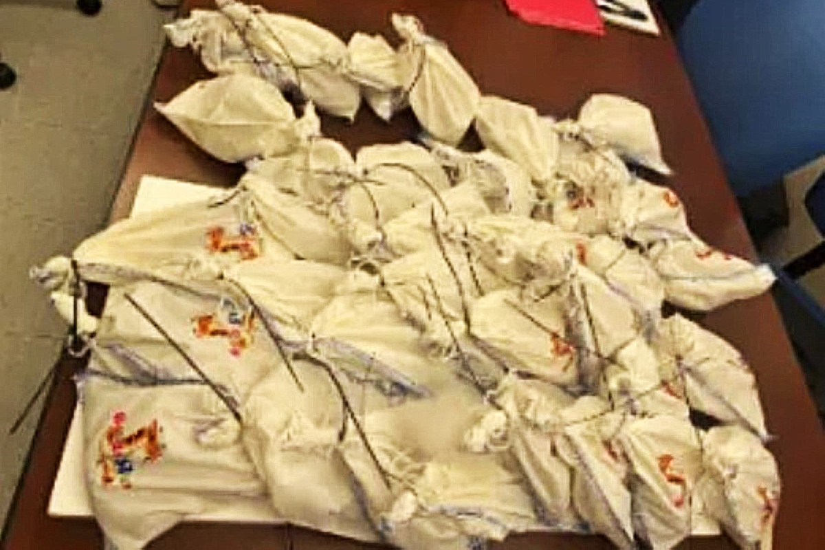A collection of fabric pouches on a table.