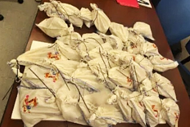 A collection of fabric pouches on a table.