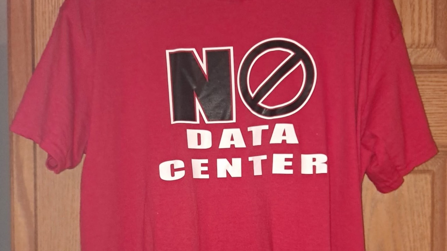 A red T-shirt with text that says "No Data Center."
