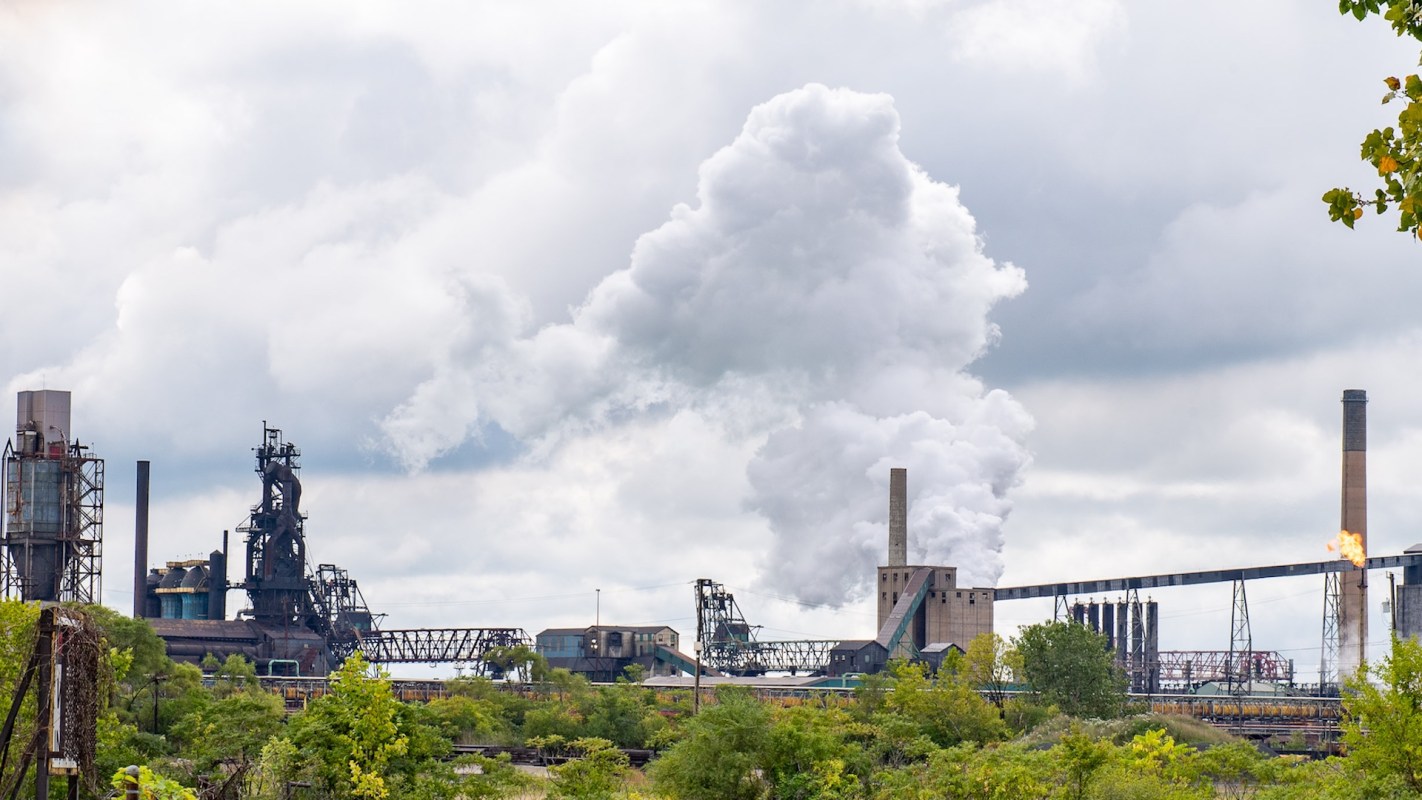 Smoke rising from an industrial facility.