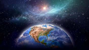 Earth is shown from space, surrounded by a starry universe and a glowing haze.
