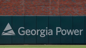 A sign for Georgia Power on a wall.
