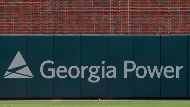 A sign for Georgia Power on a wall.