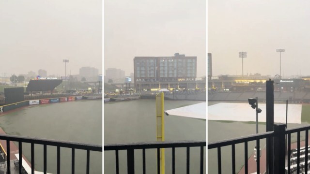 A baseball field covered in water.