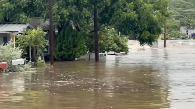 A neighborhood in Sonora, Texas, submerged in floodwater.