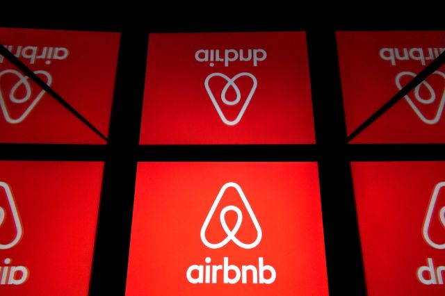 Multiple red panels displaying the Airbnb logo.