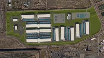 An aerial view of a large industrial complex with multiple buildings and parking areas.