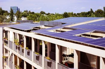 Solar panels on the roof of an apartment building.