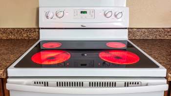 An electric stove with red-hot burners.