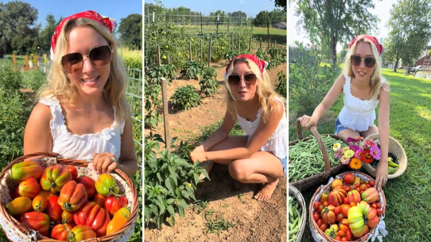 A woman in a garden, showcasing baskets filled with vegetables.