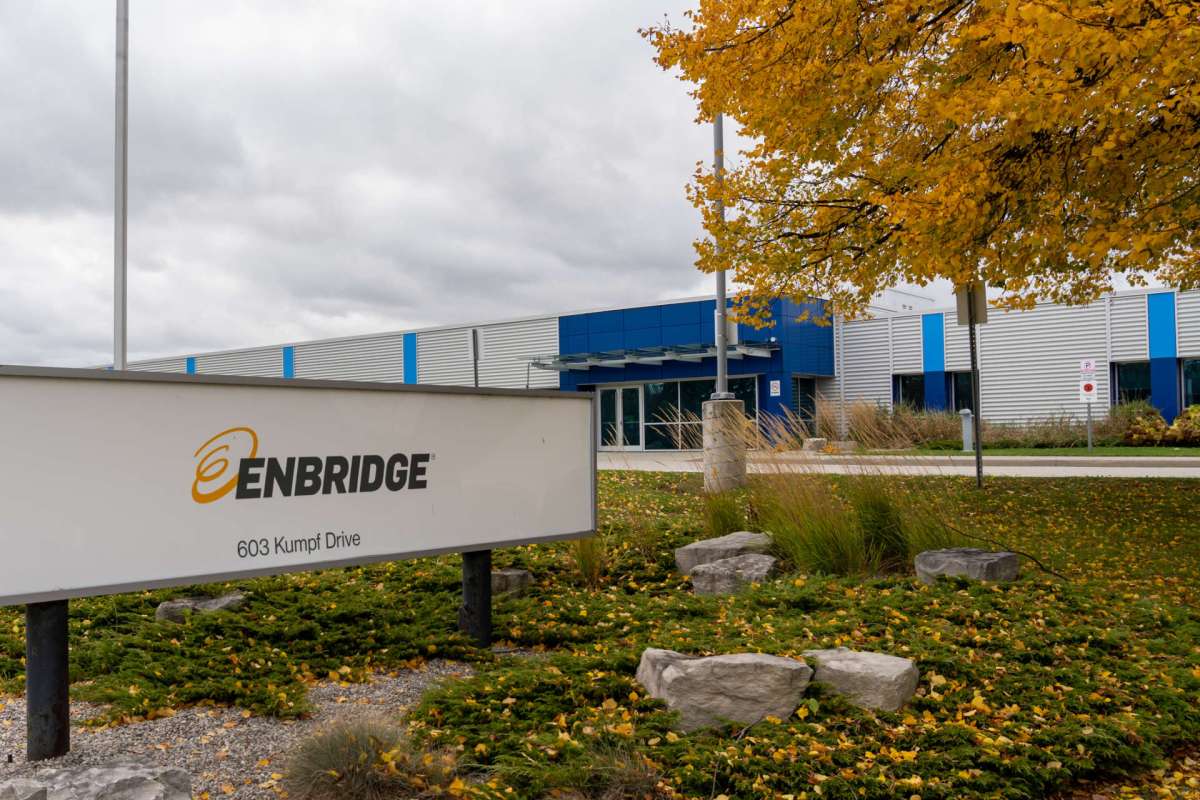 A sign for Enbridge at a company building.