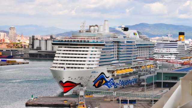 A cruise ship docked at port.