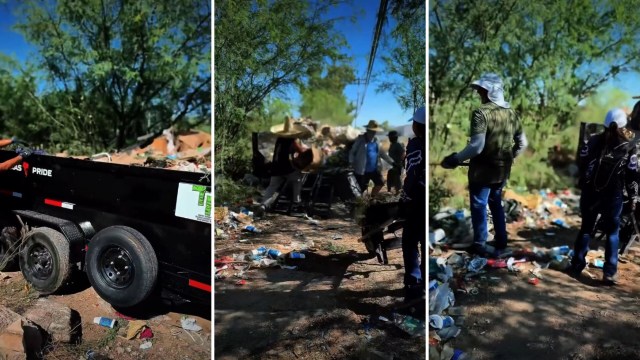 A group of people cleaning up a littered area with trees and a trailer nearby.