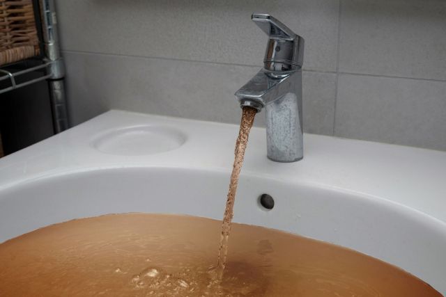 Brown tap water.