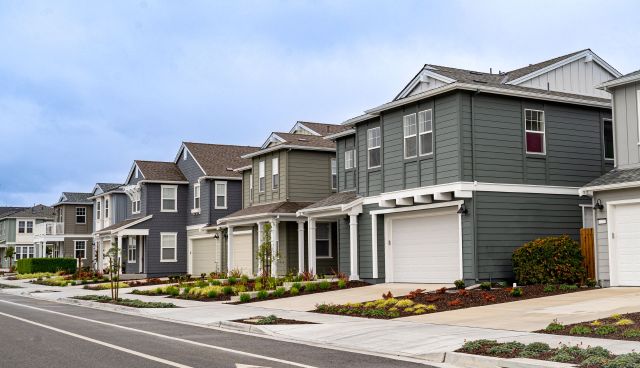 A row of single-family homes in a suburban neighborhood.