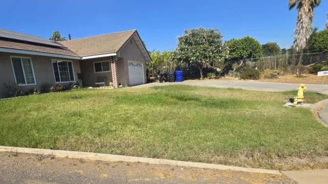 A house with a turf lawn.