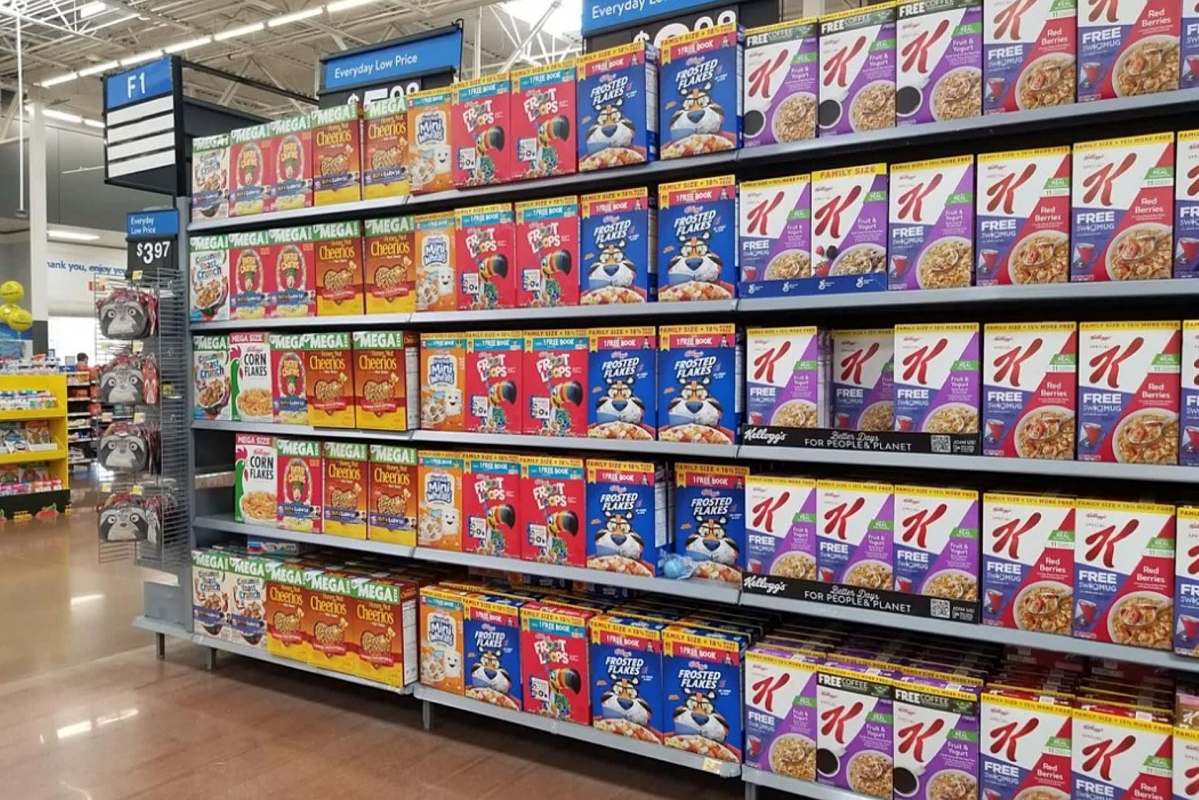 A grocery store aisle filled with various brands of cereal boxes on display.