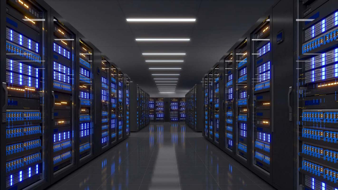 A dimly lit data center corridor lined with glowing server racks.