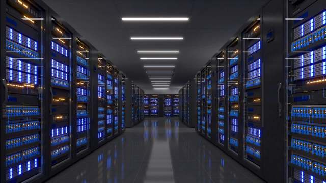 A dimly lit data center corridor lined with glowing server racks.