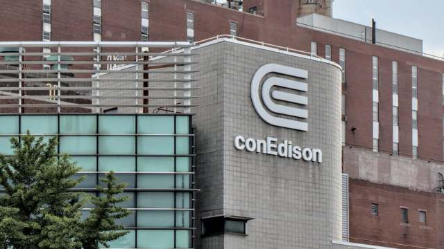 A conEdison building with modern architecture featuring glass and a prominent logo on the facade.