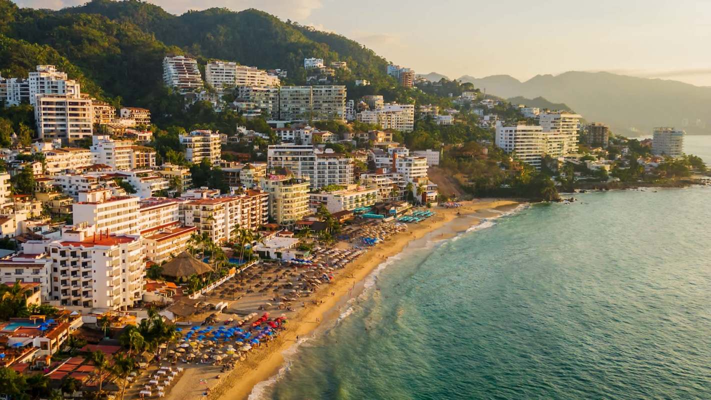 An coastal view of hotels along a beach.