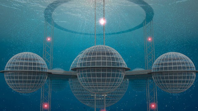 An underwater futuristic structure featuring glass spheres connected by platforms and illuminated by red lights.