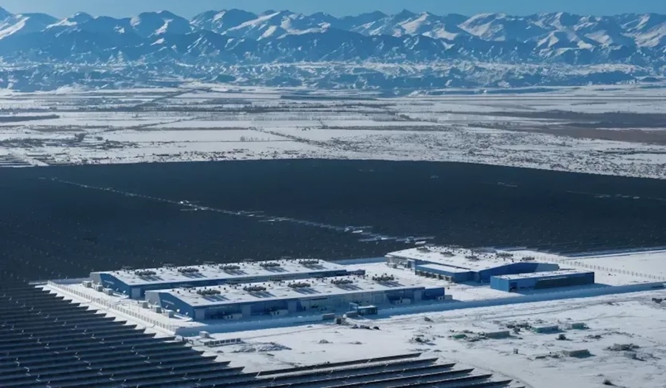 A snowy solar panel field in the Gobi Desert.
