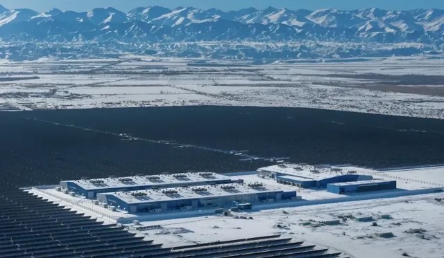 A snowy solar panel field in the Gobi Desert.