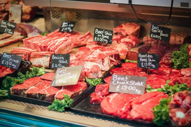 A display of beef at a butcher's counter.