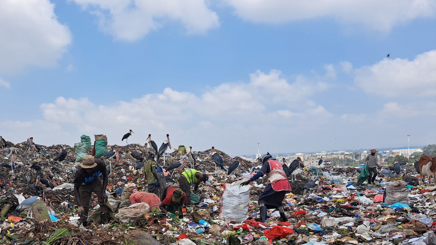 People scavenging in a landfill.