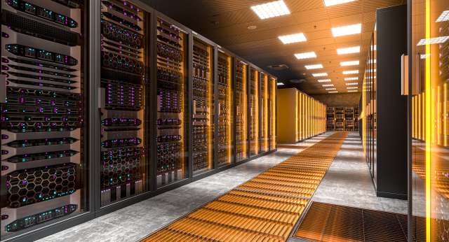 A modern data center with rows of illuminated server racks and a textured floor.