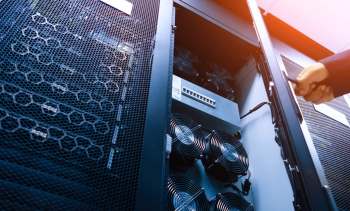 A technician opening a server rack.