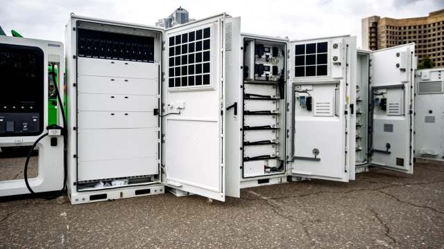 Energy storage systems with open service panels.