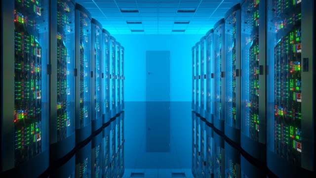 A data center with illuminated server racks.