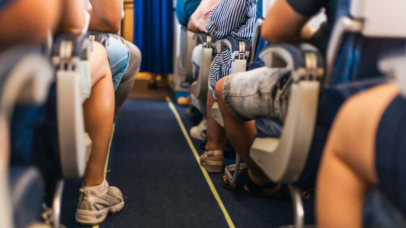 Passengers sitting in an airplane.