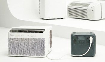 An air conditioner plugged into a power bank.