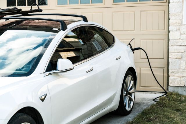 An EV plugged in and charging at home.
