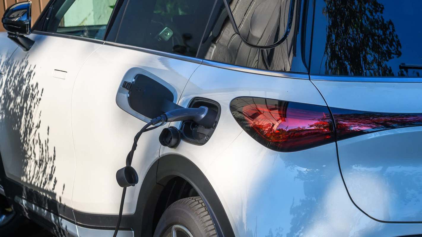An electric vehicle is plugged in for charging.