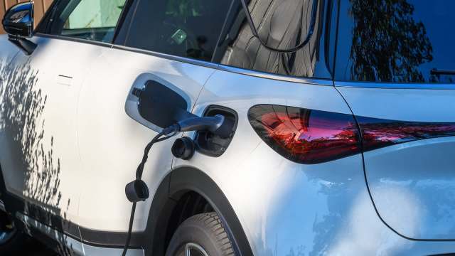An electric vehicle is plugged in for charging.