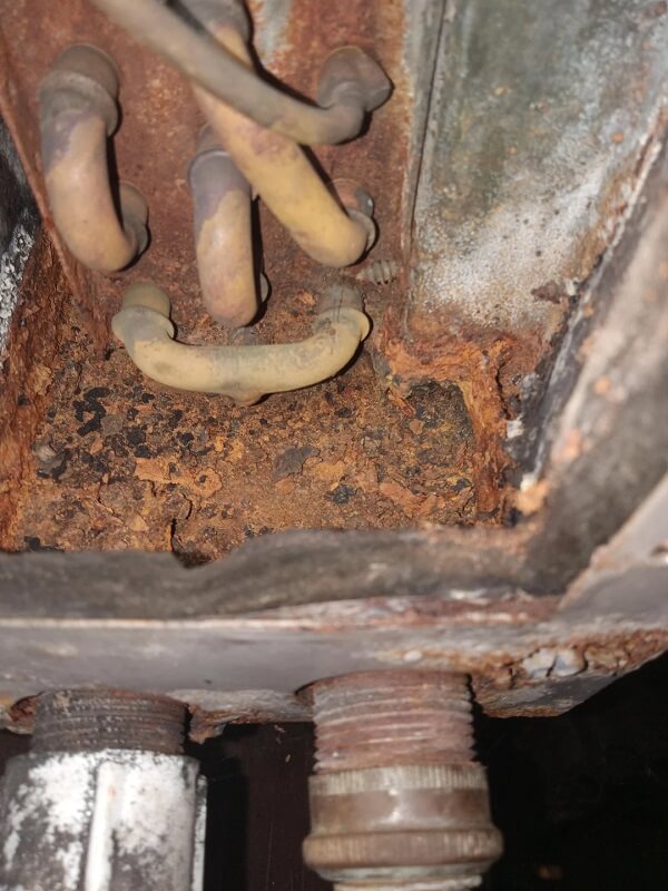 Rusted metal as part of an AC system.