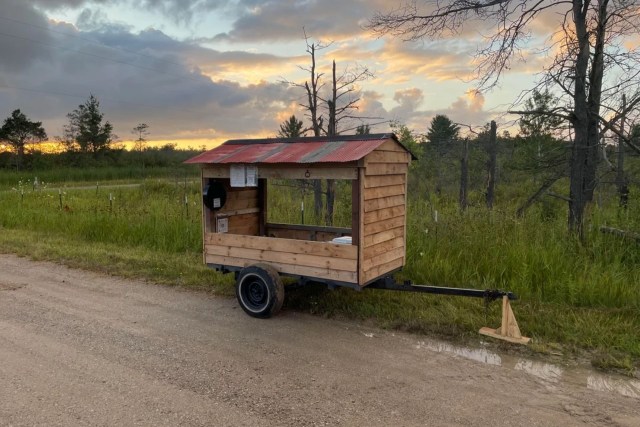 A mobile farmstand on the side of the road.